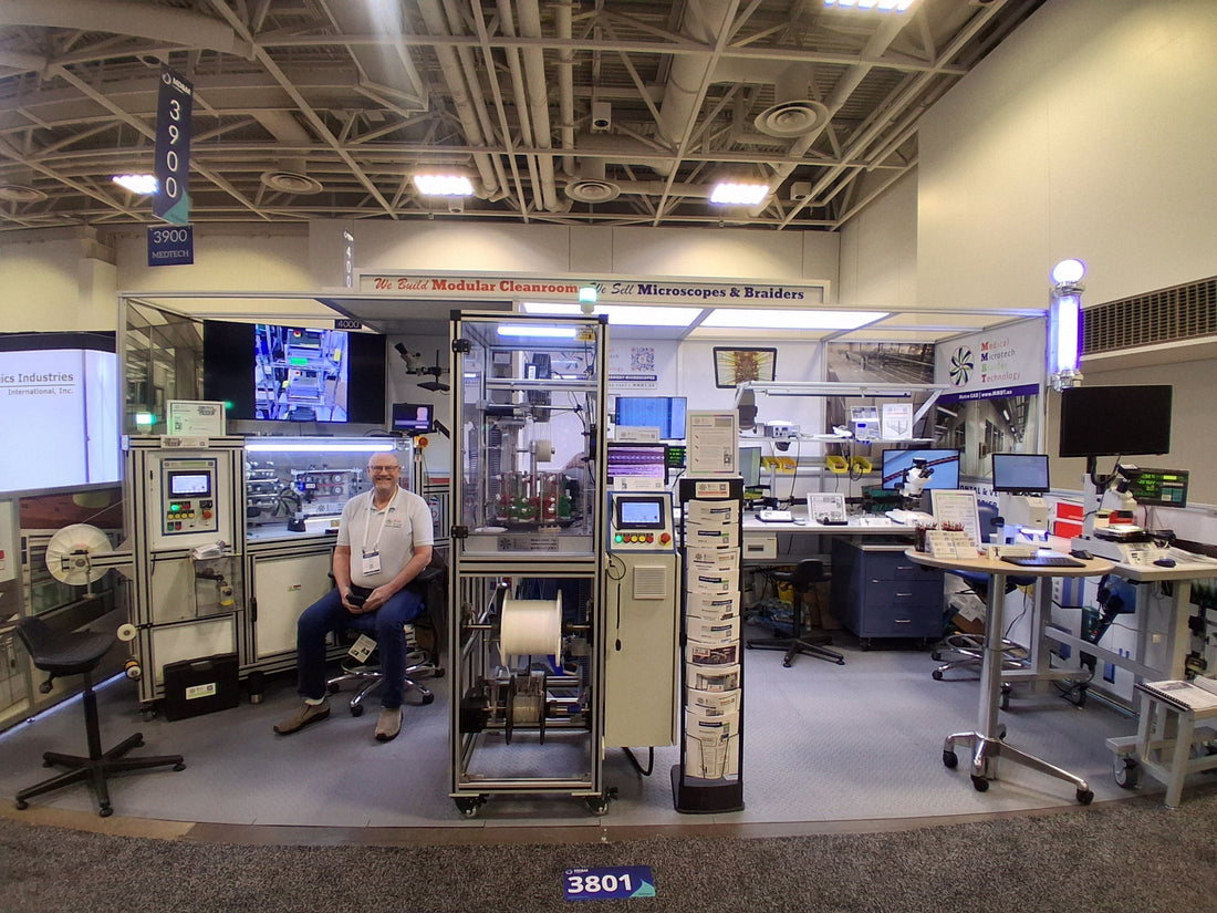 scott at MD&M tradeshow MMBT booth braiders microscopes mock cleanroom