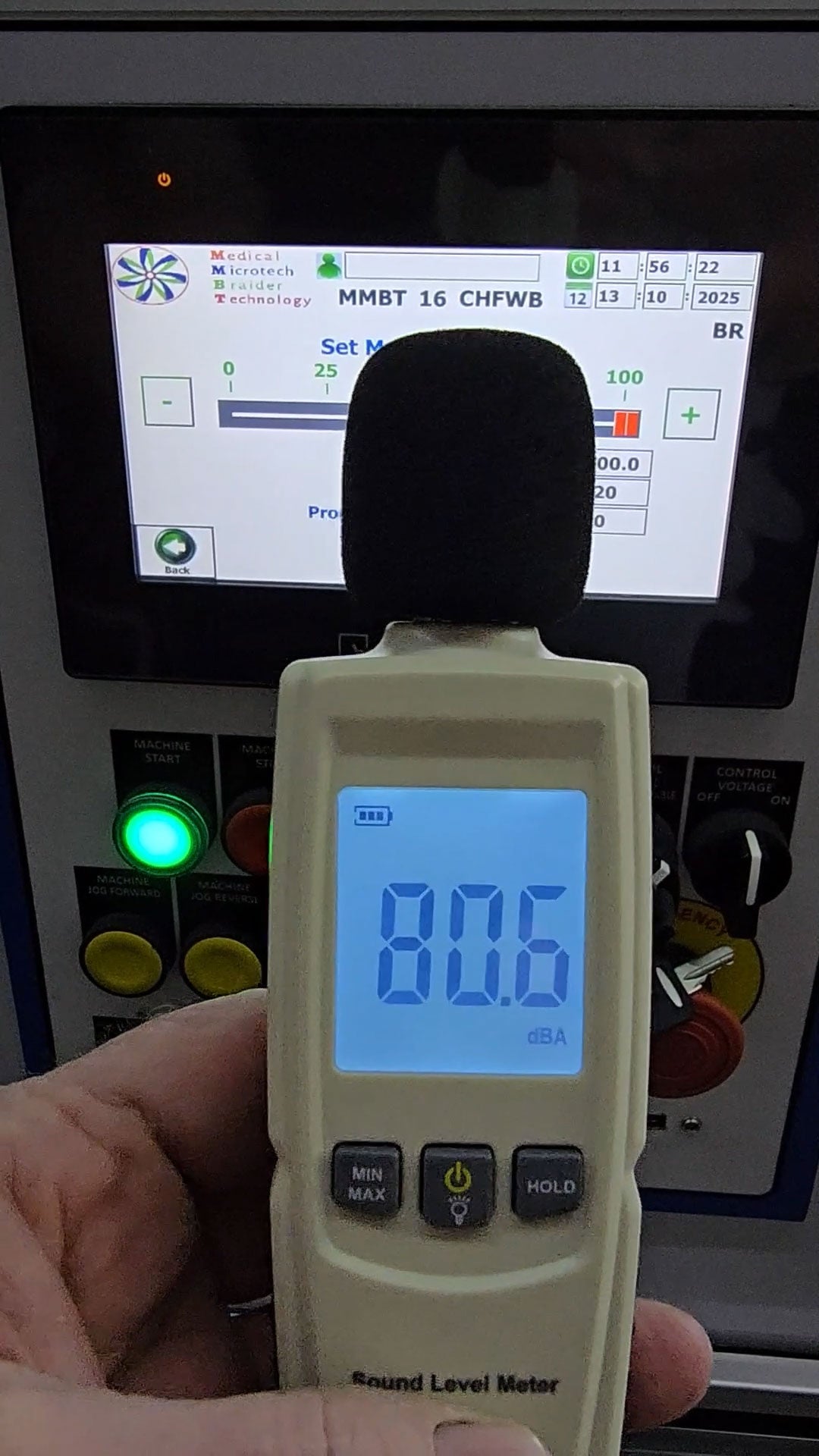 Sound level meter displaying 80.6 dB with MMBT 16 Carrier horizontal braider in the background